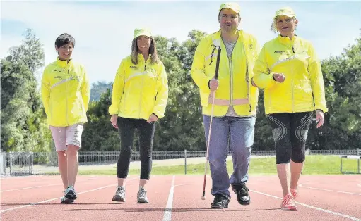  ?? PHOTO: GREGOR RICHARDSON ?? Getting ready . . . In training at the Caledonian Ground in Dunedin yesterday are (from left) Achilles Internatio­nal New Zealand Dunedin coordinato­r Stacey Pearson, athletes Hannah Scott (31) and Michael Bardrick (45) and guide Gina Wells.