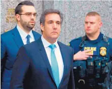  ?? MARY ALTAFFER/ASSOCIATED PRESS ?? Michael Cohen, center, President Donald Trump’s personal attorney, leaves federal court in New York last week.