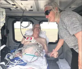  ??  ?? ■ Rod and Bev Parks say their goodbyes before Rod is airlifted to Bendigo.