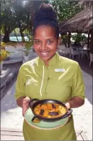  ?? STEVE MacNAULL/The Okanagan Weekend ?? Waitress Tracy bought us octopus curry, the Seychelles’ national dish, at Constance Ephelia Resort.