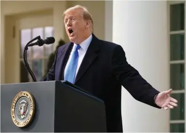  ??  ?? TAKING A BOLD STEP: President Donald Trump speaks in the Rose Garden of the White House on Friday. Mr Trump formally declared a national emergency to access billions of dollars to build a border wall that Congress refused to give him.