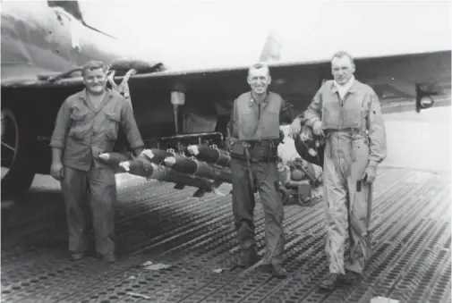  ?? (Photo by George Deans) ?? This was the crew that flew the first accredited recon mission on the evening of June 25, 1950. On the far right is Lt. George Deans and to his right is Lt. Marv Olsen. This mission was to take on a single intruder coming in from North Korea. It ended up being a B-17. This was taken at Itazuke, Japan in August 1950.