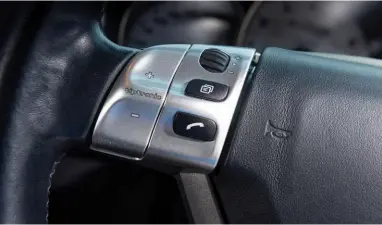  ?? ?? Below Tiptronic S moved manual override to buttons on the steering wheel, allowing instant override without having to move the lever to manual mode
Right Tiptronic accounted for a third of all 964 sales and was put to good use in the Cayenne SUV