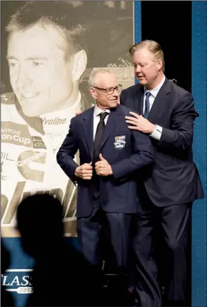  ?? Getty Images/JARED C. TILTON ?? Retired NASCAR driver Mark Martin (left) of Batesville receives his Hall of Fame jacket from NASCAR CEO Brian France before Friday night’s induction ceremony in Charlotte, N.C.