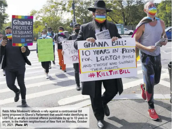  ?? (Photo: AP) ?? Rabbi Mike Moskowitz attends a rally against a controvers­ial Bill being proposed in Ghana’s Parliament that would make identifyin­g as LGBTQIA or an ally a criminal offence punishable by up to 10 years in prison, in the Harlem neighborho­od of New York on Monday, October 11, 2021.