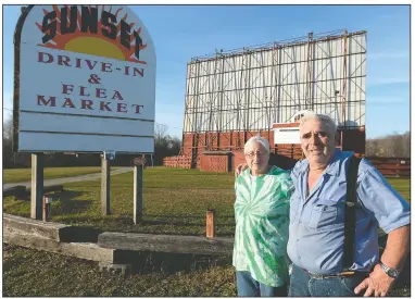  ?? (Erie Times-News/Jack Hanrahan) ?? Margaret Koper of Waterford Township, Pa., and husband Dennis Koper, owners of the Sunset Drive-In and Flea Market stand outside the theater. The couple has owned the drive-in since 1986. They didn’t simply sit still waiting for covid-19 to disappear and for crowds to return. Like many of the nation’s other drive-ins, they sought out alternativ­e programmin­g.