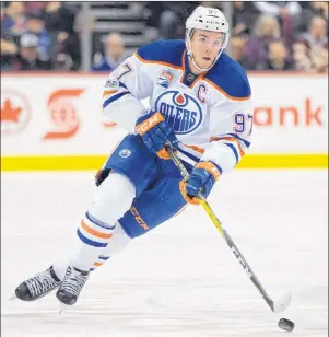  ?? CP PHOTO/DARRYL DYCK ?? Edmonton Oilers’ Connor McDavid skates with the puck during first period NHL hockey action against the Vancouver Canucks, in Vancouver, B.C., on Saturday, April 8, 2017.