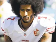  ?? Ted S. Warren / Associated Press ?? San Francisco 49ers quarterbac­k Colin Kaepernick kneels during the national anthem before an NFL game against the Seattle Seahawks in Seattle on Sept. 25, 2016.