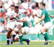  ?? — Reuters photo ?? England’s Joe Cokanasiga in action with Ireland’s Peter O’Mahony.