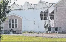  ?? BOB TYMCZYSZYN TORSTAR ?? Some of the greenhouse­s show damage from a fire at 1167 Line 6 Rd. in Niagara-on-the-Lake early Friday.