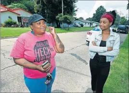  ?? [ROGELIO V. SOLIS/THE ASSOCIATED PRESS] ?? Allison Tyler talks about the educationa­l programs provided at Cleveland Central High School in Mississipp­i where her daughter, Valencia, right, attends classes. “It’s better that they brought the schools together as far as having the races interact,” Allison Tyler said.