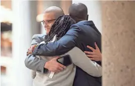  ?? BRIANNA PACIORKA/NEWS SENTINEL ?? Gavin Guinn, Constance Every and the Rev. Calvin Skinner hug after the jury read its verdict in Knox County Criminal Court on Wednesday.
