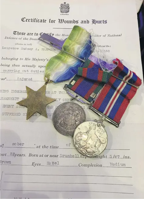  ?? TIMES COLONIST ?? Laurence Hammick’s medals and record of wounds. Hammick was one of 38 survivors from HMCS Valleyfiel­d who spent an hour in the cold, oily waters before being rescued by HMCS Giffard.