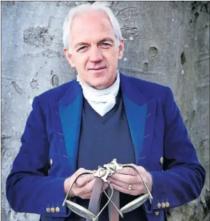  ??  ?? HISTORIC: Rider Ian Stark holds a pair of stirrups used by The Duke of Wellington at the Battle of Waterloo.