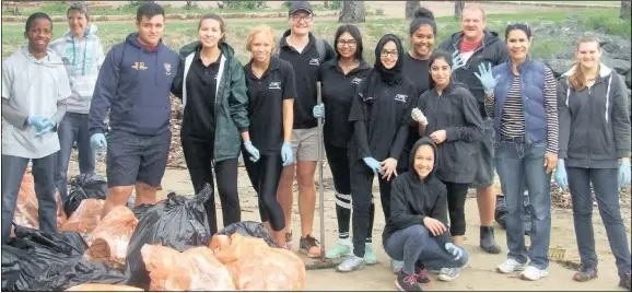  ?? PICTURES: TERRY HUTSON ?? As an initiative in observing Heritage week a group of young people from the Durban Youth Council arrived last Saturday on the tidal beach at Festival Island and began cleaning up plastic and other rubbish that had washed up over the last few...