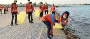  ??  ?? Snapshots from the Al Wakrah Beach clean-up drive yesterday.