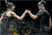  ?? GETTY IMAGES ?? Joelle King, left, and Coll bump fists after a doubles win in the Commonweal­th Games on the Gold Coast last year.