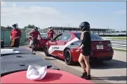  ?? NATALIE BRODA — OAKLAND PRESS FILE PHOTO ?? Performanc­e drivers take guests out on the track at M1 Concourse in Pontiac.