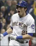  ?? Morry Gash The Associated Press ?? Milwaukee Brewers outfielder Christian Yelich celebrates after hitting a home run against the Detroit Tigers on Saturday.