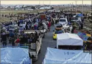  ?? NABAA MEDIA ?? Near the Syria-Jordan border, people flee from Daraa, June 30. Activists and state media said rebels have agreed to surrender Daraa, the first city to revolt against President Bashar Assad seven years ago.