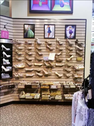 ?? Mackenzie Carpenter/Post-Gazette ?? At Reyer’s Shoe Store in Sharon, there’s a wall of golden shoes that would be perfect for any prom dress.