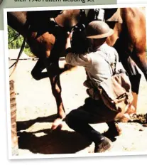  ??  ?? In this period photograph, the angled haversack is easily visible whilst this trooper attends to his horse