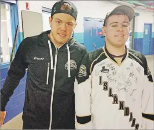  ?? PHOTO SPECIAL TO THE GUARDIAN, COLIN MACPHAIL/TELEGRAPH-JOURNAL ?? Charlottet­own Islanders star forward Daniel Sprong, left, meets up with superfan Adam Cripps during a recent road game against the Saint John Sea Dogs. While Cripps lives only a few kilometres outside of Saint John, the 18year-old, who has autism, is a...