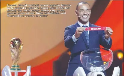  ?? ?? Former Brazil football team captain Morais Cafu pulled England’s name out of the hat
during the 2022 Qatar World Cup group games draw at the Doha Exhibition and
Convention Centre in Qatar