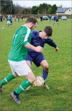  ??  ?? Riain Sweetman of Wicklow Rovers and Sam O’Callaghan of Glencormac United battle for possession.