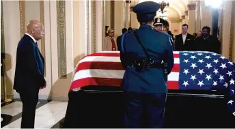  ?? ANNA MONEYMAKER/POOL VIA AP ?? U.S. Rep. John Lewis, D-Ga., pays his respects to Rep. Elijah Cummings, D-Md., as Cummings lies in state Thursday at the U.S. Capitol in Washington, D.C.