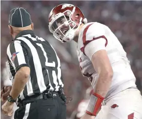  ?? (Photo by Brynn Anderson, AP) ?? Arkansas quarterbac­k Cole Kelley argues with an official during the first half of last Saturday’s game against Alabama.