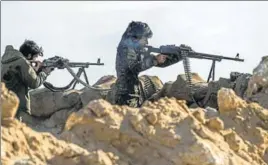  ?? AFP ?? Fighters with the US-backed Syrian Democratic Forces take part in an operation to expel Islamic State militants in the Baghouz area of Deir Ezzor, Syria.