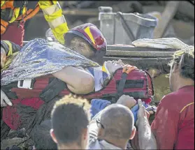  ?? MASSIMO PERCOSSI / ANSA ?? An injured woman is carried by rescuers in Amatrice, Italy, where a 6.1 earthquake struck just after 3:30 a.m. Wednesday. The quake was felt across a broad section of central Italy, including the capital Rome, and was followed by hundreds of...