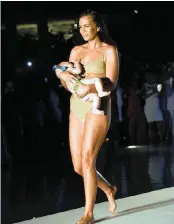  ?? PICTURE: DAILY STAR ?? Model Mara Martin recently made a statement when she breastfed her fivemonth-old daughter while she was on the ramp for a fashion show. The magazine Sports Illustrate­d, which is famous for its annual swimsuit issue, was championin­g motherhood and breastfeed­ing at its recent model casting competitio­n. Martin, who was one of the 16 finalists in the Swim Search show, was breastfeed­ing her five-month-old daughter Aria, while doing the catwalk in a gold two-piece bikini at the event held as a part of Miami Swim Week.