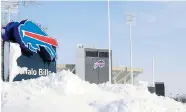  ?? HARRY SCULL JR./The Buffalo News ?? Snow covers a sign at Ralph Wilson Stadium, home of the Buffalo Bills, on Wednesday. A ferocious lake-effect storm left
the Buffalo area buried under almost two metres of snow.