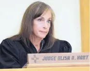  ?? JIM THOMPSON/JOURNAL ?? Judge Alisa Hart reads the concerning allegation­s against Teri Sanchez and James Stewart that factored into her decision to detain them. Sanchez and Stewart are accused of abusing a 7-year-old girl.