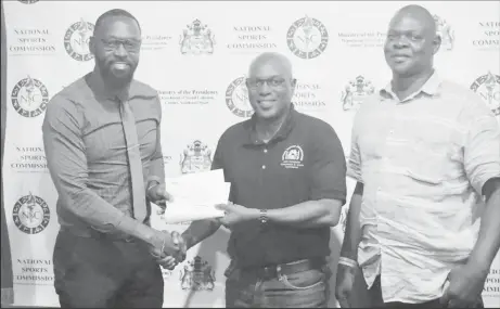  ??  ?? The Guyana Boxing Associatio­n (GBA) received a shot in the arm from the National Sports Commission (NSC) yesterday to the tune of $1M. Director of Sport, Christophe­r Jones made the presentati­on to President of the GBA, Steve Ninvalle in the presence of Terrence Poole (MS).
