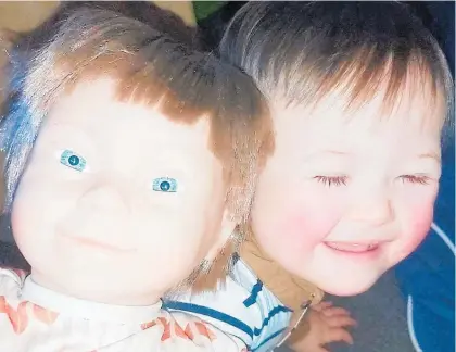 ?? Photo / Supplied ?? Cayden, who has Down's syndrome, now has a new doll to play with.