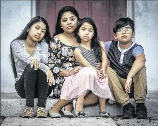  ?? DAMON HIGGINS / THE PALM BEACH POST ?? The Perez children (from left) Nalleli, 13, Sandra, 24, Stefanie, 6, and Hector, 11, at their West Palm Beach home last week. Their father, Hector Perez Mazariegos, a Guatemalan immigrant, was deported during the Obamaera deportatio­n crackdown. He...