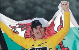  ?? FRANCOIS MORI THE ASSOCIATED PRESS ?? Tour de France winner Geraint Thomas celebrates on the podium in Paris on Sunday.