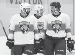  ?? JORDAN MCPHERSON jmcpherson@miamiheral­d.com ?? Former Panthers Keith Yandle, left, and Roberto Luongo chat on the ice during the Panthers alumni vs. NHL alumni game on Wednesday at the Ice Den in Coral Springs.