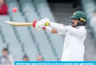  ?? —AFP ?? ADELAIDE: Pakistan batsman Yasir Shah hits out on the way to scoring his century against Australia on the third day of the second cricket Test match in Adelaide yesterday.