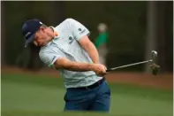  ?? ■ The Associated Press ?? Justin Rose, of England, hits on the 12th hole during the first round of the Masters golf tournament Thursday in Augusta, Ga.