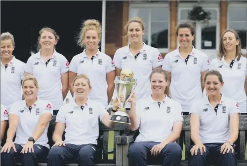  ?? PICTURE: PA ?? CHAMPIONS: England women’s cricket team pose with the World Cup trophy at Lord’s following their thrilling win over India on Sunday.