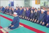  ?? REUTERS ?? Syria’s President Bashar alAssad (third from right) attends prayers on the first day of Eid alAdha, inside a mosque in the town of Qara, north of Damascus, near an enclave surrendere­d on Monday by the Islamic State fighters.