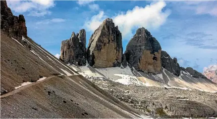  ?? PHOTOS: NEIL RATLEY/STUFF ?? The Tre Cime di Lavaredo, a trinity of towers, is the most famous landmark in the Dolomites.
