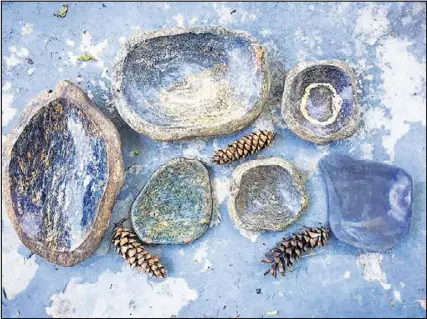  ?? CONTRIBUTE­D BY HUTCHINS STONEWORKS ?? Stephen Hutchins’ organicall­y shaped, natural-edged bowls fit well in a rustic setting, while his sculptural bowls, polished on all sides, offer a more clean and refined look.