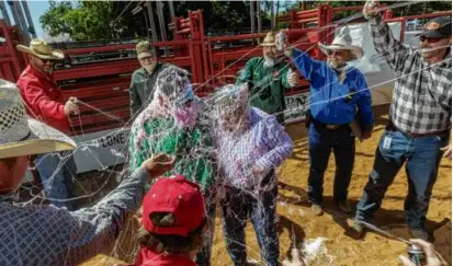  ?? SHELBY TAUBER/AFP VIA GETTY IMAGES/FILE ?? With fireworks prohibited in areas like the Sandia Mountains that border Albuquerqu­e (left), Forest Service managers urged July Fourth revelers to switch to Silly String for celebratio­ns.