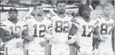  ?? MATT LUDTKE — THE ASSOCIATED PRESS ?? Like many players around the NFL last week, the Green Bay Packers linked arms during the national anthem Thursday as a sign of unity.