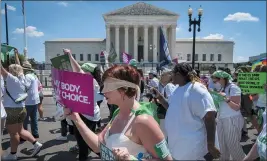  ?? JACQUELYN MARTIN — THE ASSOCIATED PRESS ?? Mahayana Landowne, of Brooklyn, N.Y., wears a “Lady Justice” costume as she marches past the Supreme Court during a protest for abortion-rights Thursday.